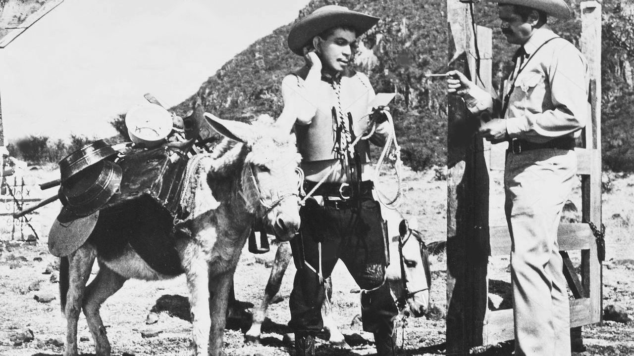 Por mis pistolas Background